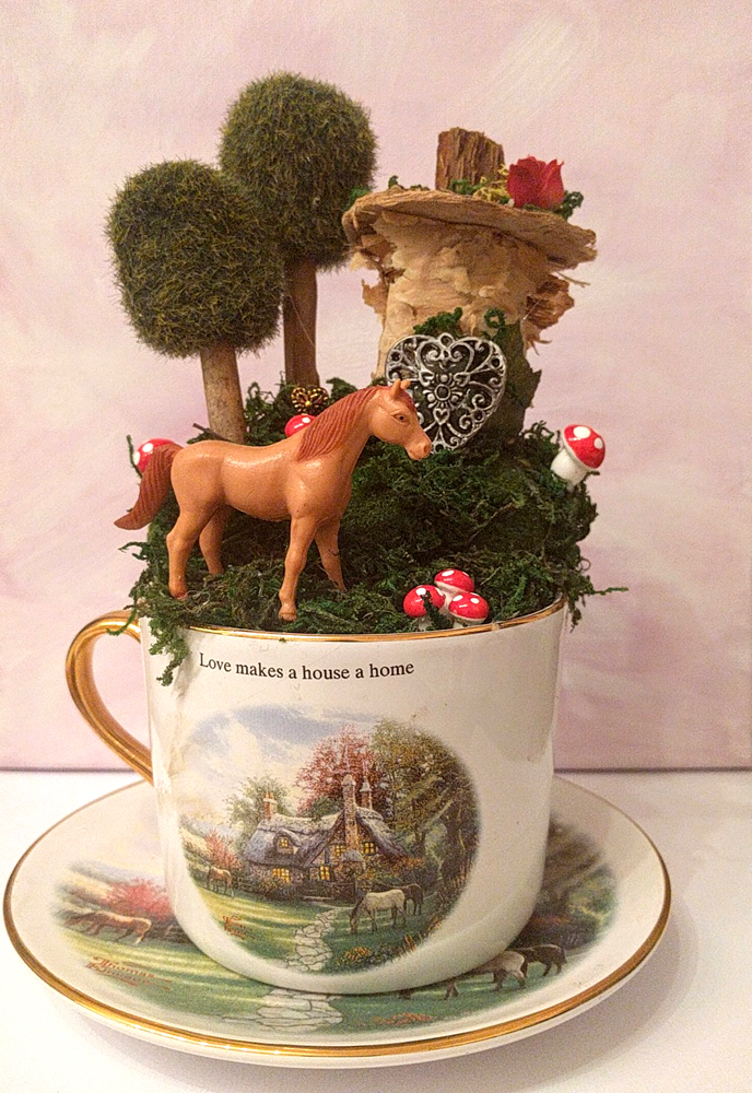Horse fairy garden in Thomas Kinkade tea cup and saucer by Janell Mithani